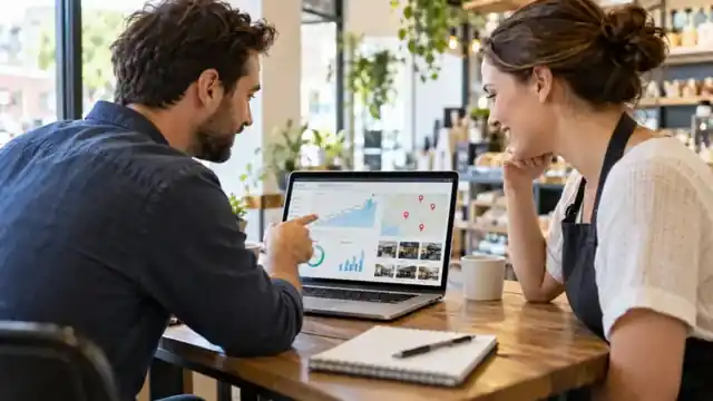 Local business owner and SEO consultant reviewing improved local search visibility
